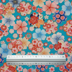 Tissu coton gaufré turquoise à motifs de fleurs de cerisier colorées (110cm)