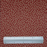 Tissu coton petites fleurs de cerisier fond rouge foncé (110cm)